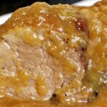 Medallones de solomillo de cerdo en salsa española con verduras