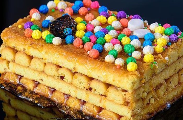 Turrón Doña Pepa con miel y grageas de colores receta peruana