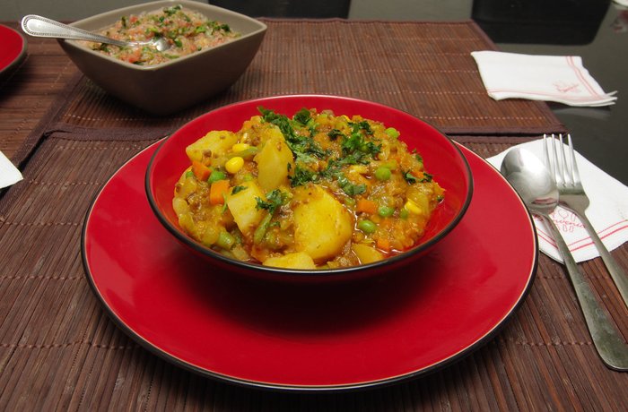 Charquicán chileno casero con zapallo y huevo frito receta tradicional
