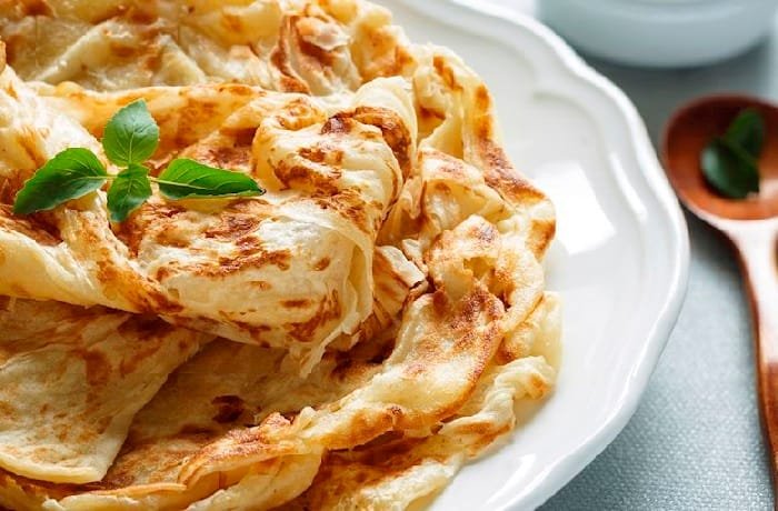 Roti canai pan plano en capas receta de Malasia