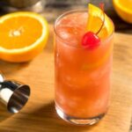 Cóctel sex on the beach en vaso alto con naranja receta casera